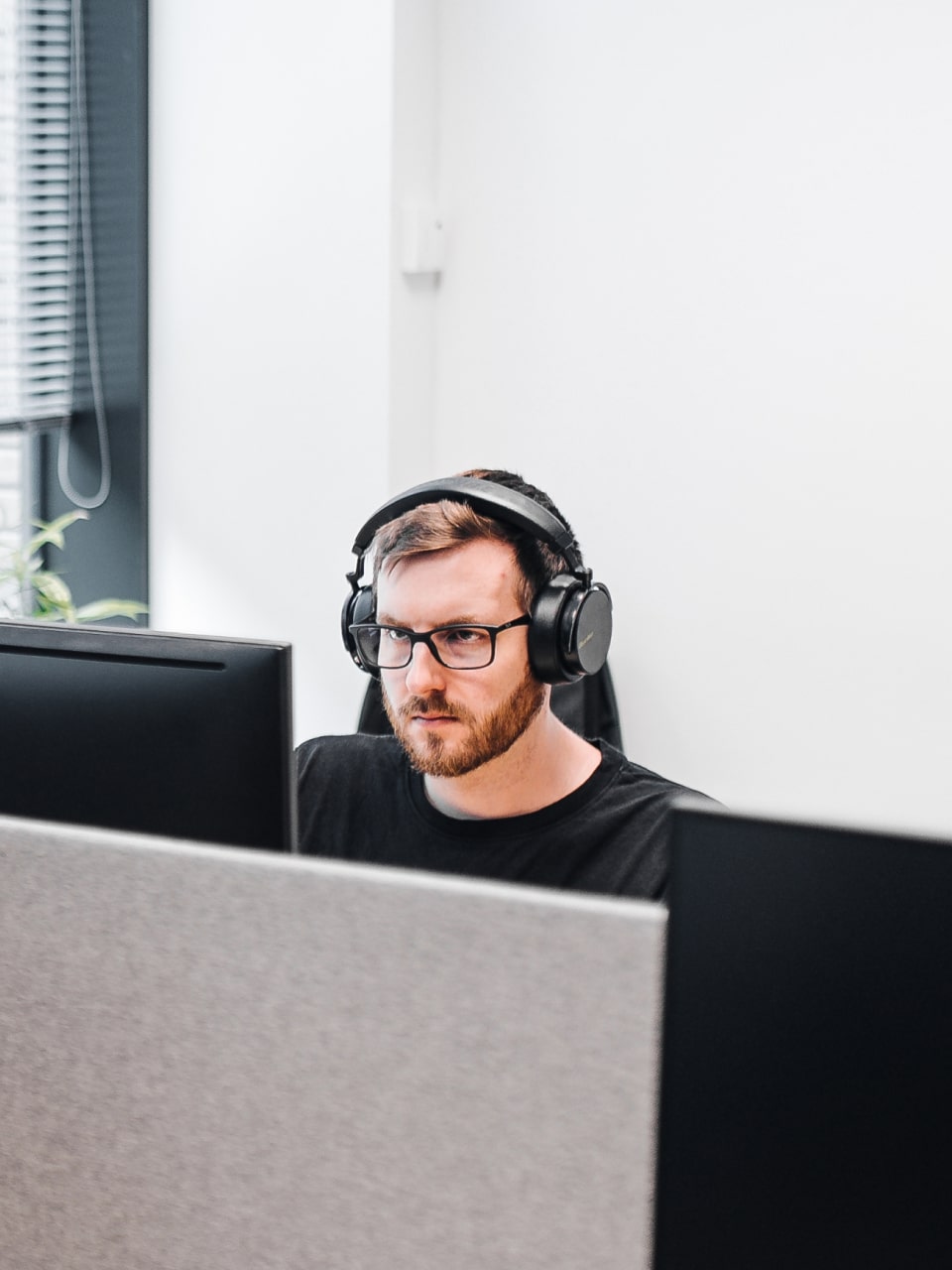 Software Engineer focusing with headphones